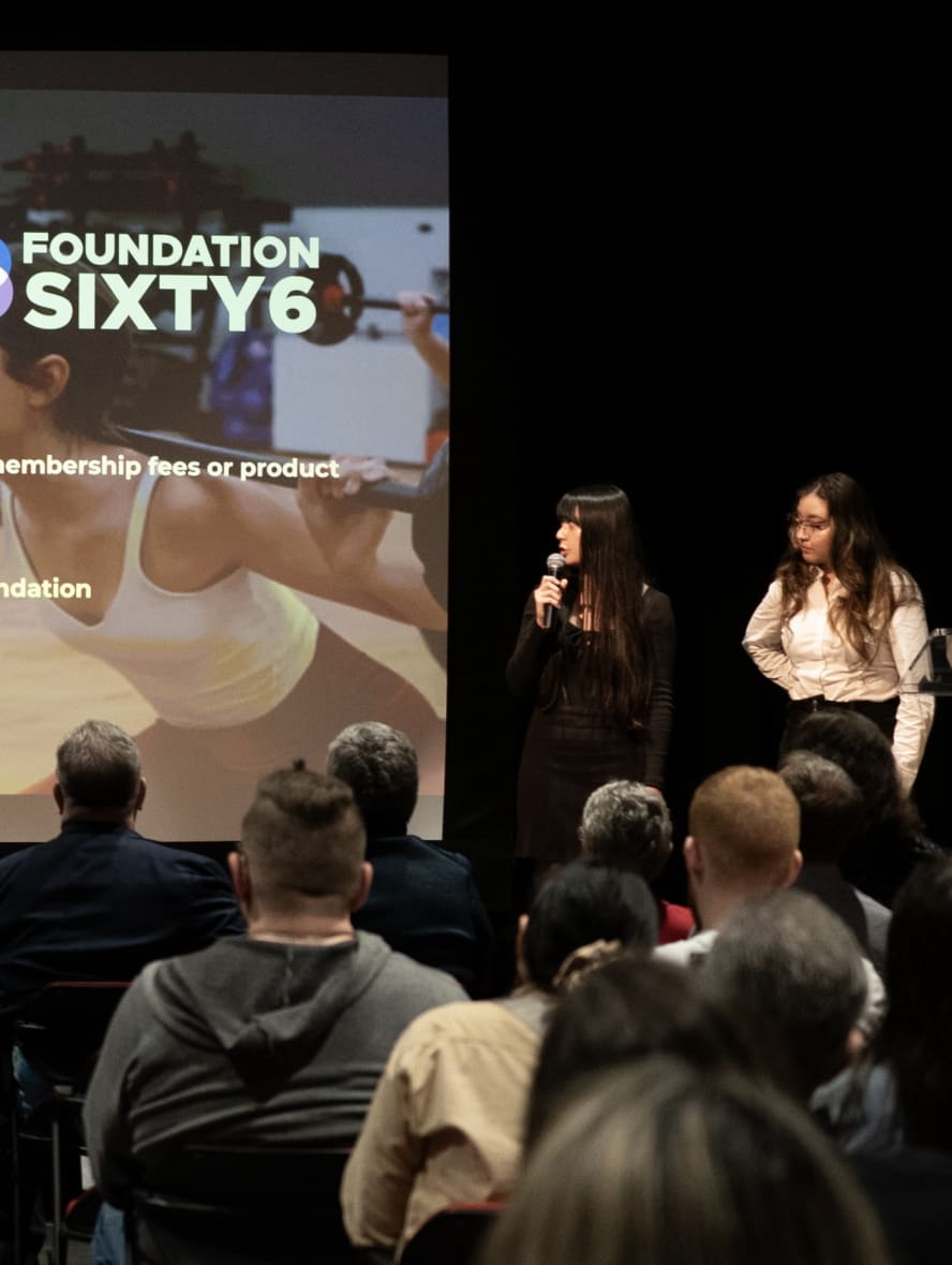 people presenting on stage